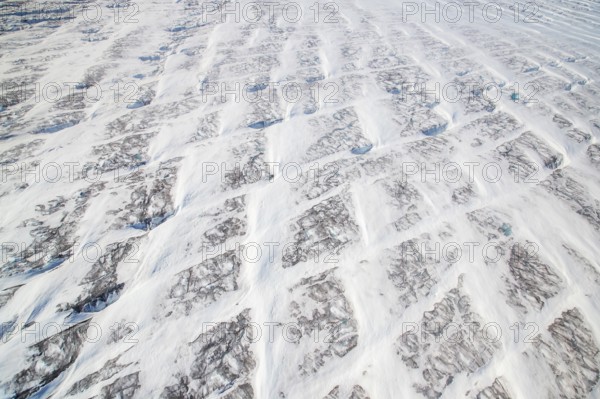 Aerial view of Ice sheet in Greenland, Arctic landscape, frozen wilderness, glaciers and