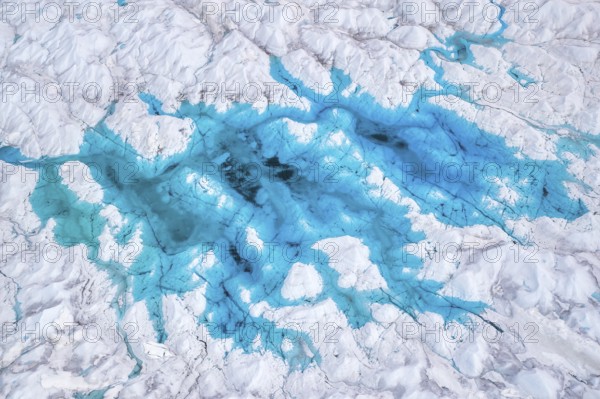 Aerial view of meltwater on the Greenland ice sheet, Arctic landscape, frozen wilderness, glaciers
