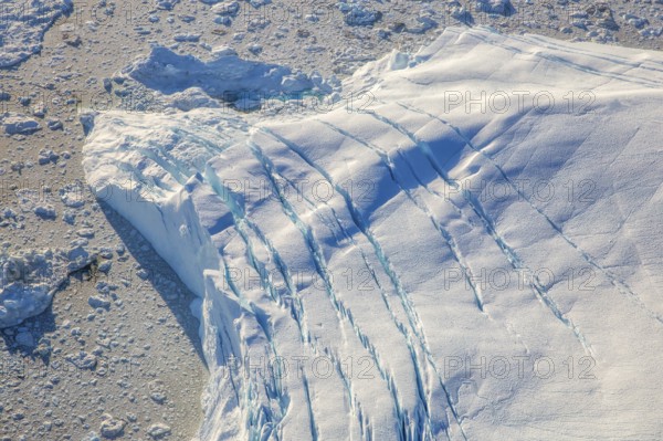 Aerial view of a big iceberg, Arctic landscape, frozen wilderness, glaciers and snow-covered