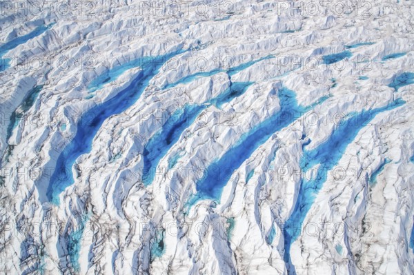 Aerial view of meltwater on the Greenland ice sheet, Arctic landscape, frozen wilderness, glaciers