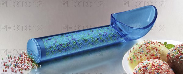 Blue, transparent ice cream scoop filled with coloured sugar sprinkles, next to a plate with