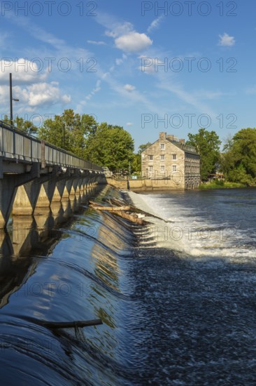 Moulin Neuf water flow control dam and walkway over Des Mille-Iles river plus New Mill on Ile des