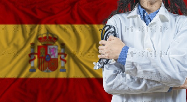 Healthcare professional with Spain flag background. Professional doctor holding stethoscope on