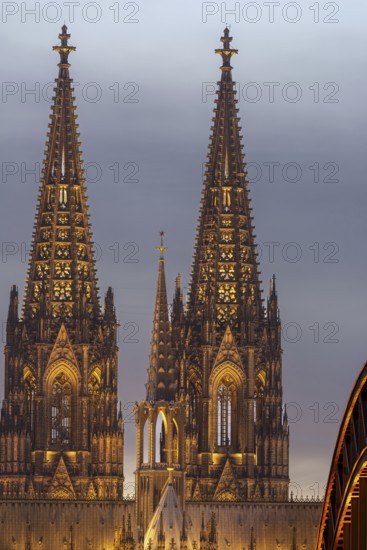 Evening atmosphere, Cologne Cathedral illuminated with LED lamps and the Hohenzollern Bridge,