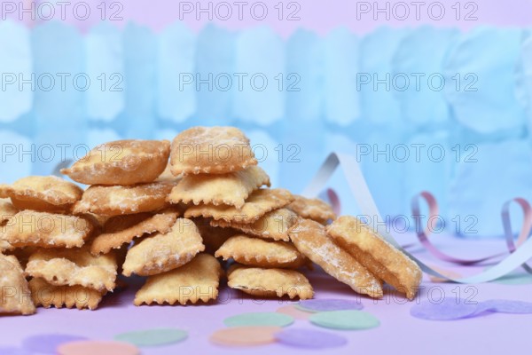 Rhenish pastries called 'Mutzen pastries or Muzenblätter' with powdered sugar on festive background