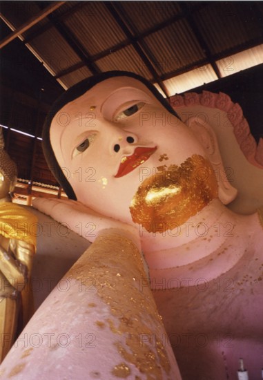 Reclining Buddha in Wat Srisoonthron Temple, Koh Siray The reclining Buddha symbolizes the last