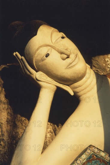 Reclining alabaster Buddha at Wat Sai Thai. The reclining Buddha symbolizes the last earthly hours