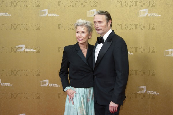 Mads Mikkelsen with woman Hanne Jacobsen, EUROPEAN FILM AWARDS Berlin 2026, photo call at the House