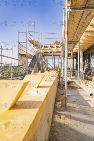 View of scaffolding with wooden panels under a clear sky, carpentry, new building, Stuttgart,