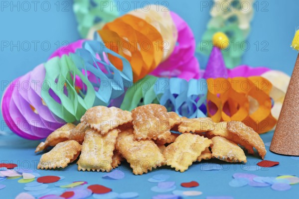 Rhenish pastries called 'Mutzen pastries or Muzenblätter' with powdered sugar on festive background