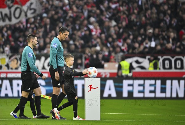 Start of a soccer Bundesliga game, shooting team led by referee Deniz Aytekin with ball child, ball