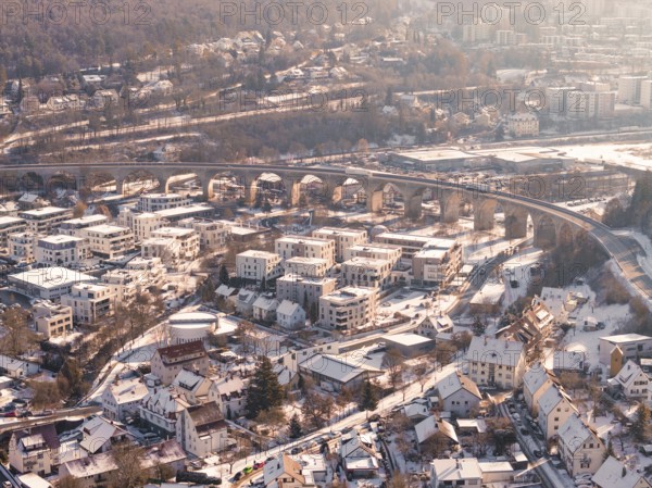 Snowy town with an impressive viaduct in a hilly landscape, Nagold, Calw district, Black Forest,