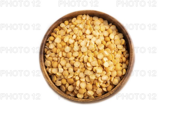 Split Pea raw in wooden bowl isolated on white background. Diet, healthy eating concept. top view,