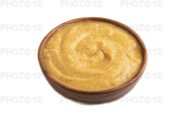 Pea cream soup, Puree, porridge in wooden bowl isolated on white background. Diet, healthy eating