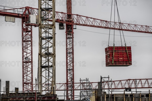 Construction site, a major construction project, apartments and commercial premises, symbolic image