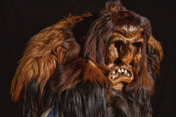 Portrait of traditional hand-carved wooden mask from the Loetschental Carnival, representing
