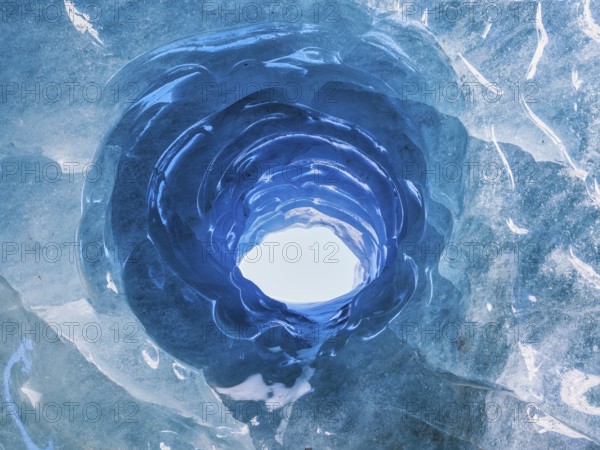 Hole in an ice cave, formed by melting and subglacial streams, Climate Change, Global Warming,