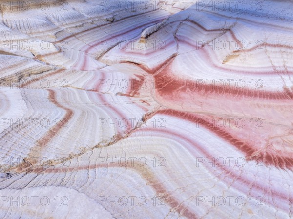 Sunset at Kyzylkup Hills (Tiramisu), colorful layered rock formations with red and white bands,