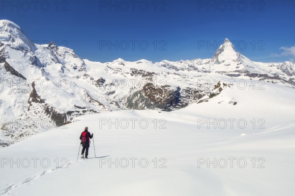 Snowshoeing in the Gornergrat region with views of the surrounding mountains and the Matterhorn,