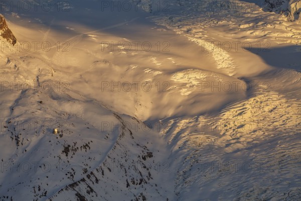 Sunset at Monte Rosa Hut (2, 883?m), alpine refuge in the Pennine Alps on the Italy–Switzerland