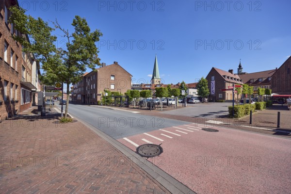 Residential building, brick building, general architecture, church tower of St. Remigius, sidewalk,