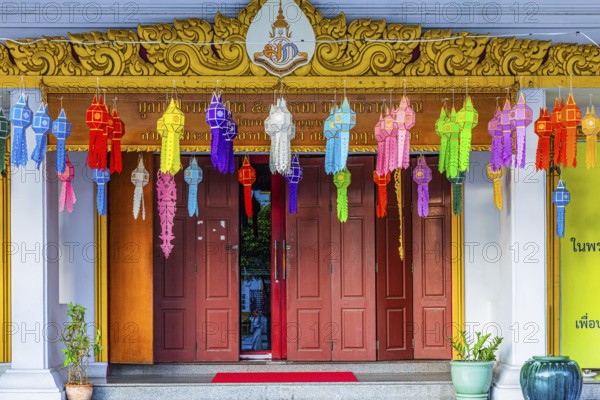 Decorated entrance to Wat Yannawa Buddhist temple decorated with colored lanterns, Bangkok,