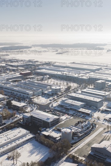 Snowy industrial area in Europe with numerous buildings and clear skies, Wolfsberg industrial area,