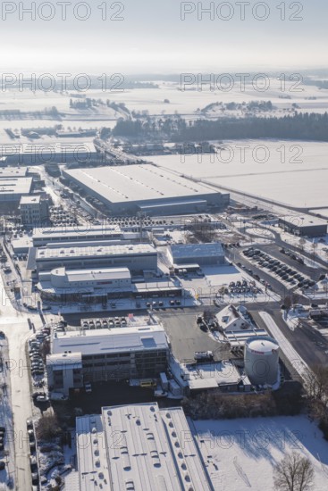 Industrial complex in a snowy landscape with clear skies, Wolfsberg industrial area, Nagold,