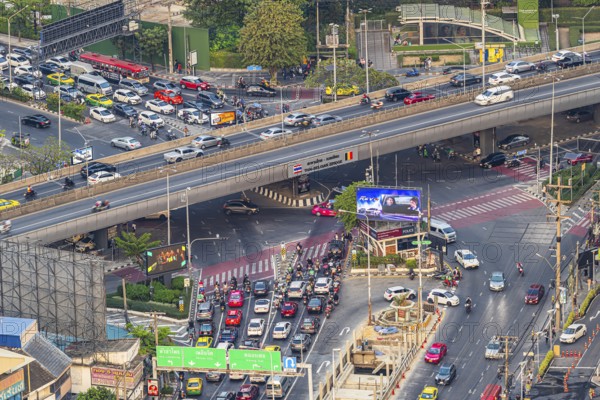 Busy road intersection with the Thai-Belgian Bridge, view from the Moon Bar on the roof terrace of