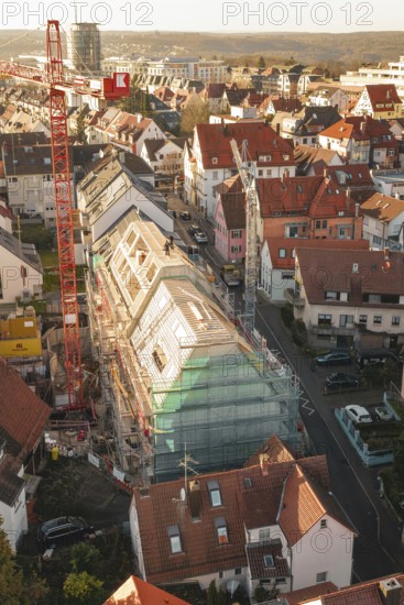 Bird's eye view of a residential area with construction site in the midst of numerous residential