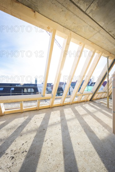 Roof truss with wooden structure and shade under sunny sky, carpentry, renovation, roof extension,