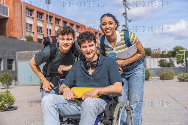 Happy young students, including a person using a wheelchair, standing together on a university