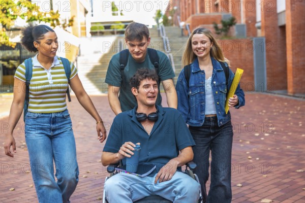 Group of diverse university students walking together on campus, one male student using a