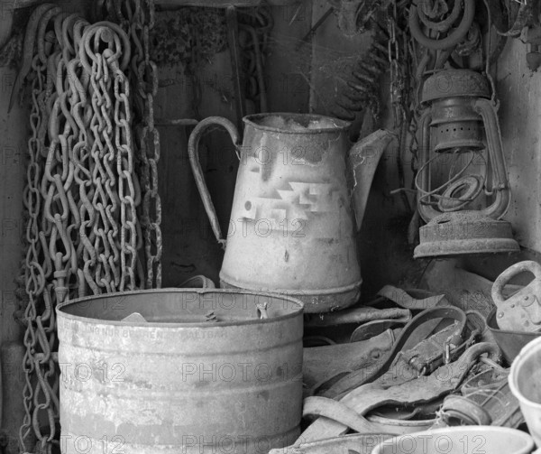 Chains, old coffee pot and collected utensils in an old cupboard on a farm, Middle Franconia,