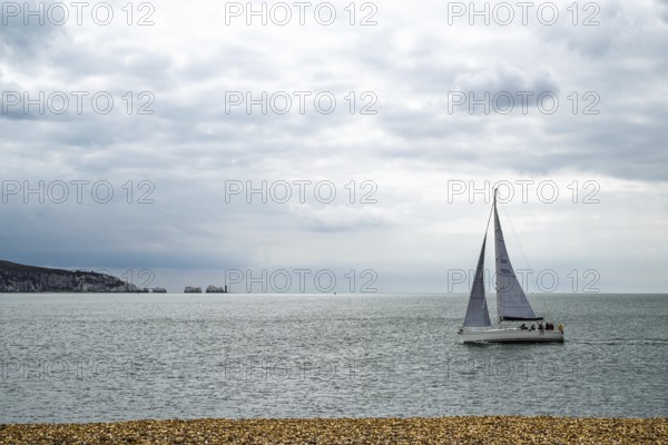 Yacht over Hurst Spit, Milford on Sea, Lymington, Hampshire, UK