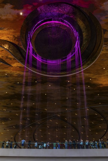 Artificial, brightly lit waterfall, Magic Waterfall, falls from the ceiling of the Iconsiam