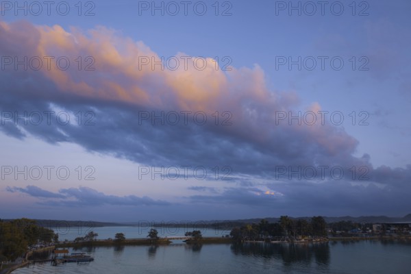 Scenic sunsets and colourful colonial architecture of historic center of Flores, Guatemala. View of