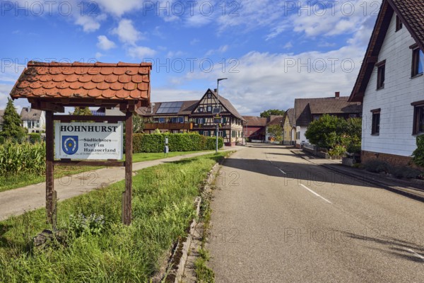 Tourist sign Hohnhurst - southernmost village in Hanauerland, houses, general development, road,
