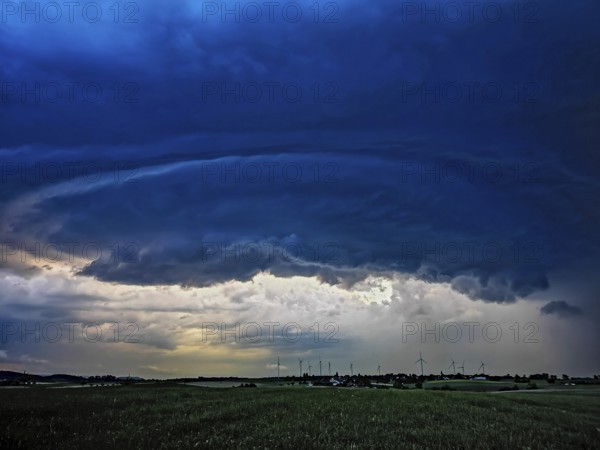 Supercell, approaching thunderstorm with impressive and threatening cloud formation of a