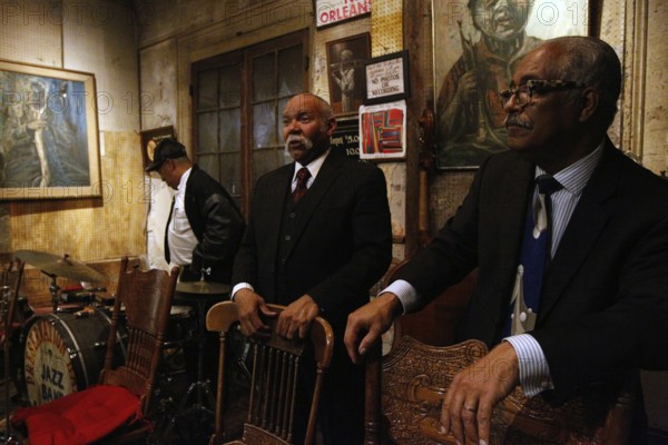 Musician at Preservation Hall ready for a jazz performance in a stylish atmosphere, New Orleans,