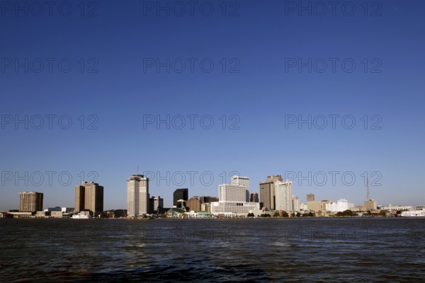 Wide view of New Orleans skyline with clear sky from afar, New Orleans, Louisiana, USA
