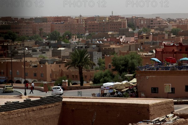 View of the city of Ouarzazate with palm trees and traditional architecture, Ouarzazate, Kasbah