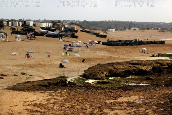 Extensive beach with visitors and lots of tents on the sand, Oulidia, Marrakesh-Safi region,