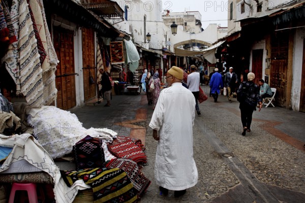 Bustling alley in the Medina of Rabat with people wearing traditional clothes, Rabat-Salé-Kénitra,