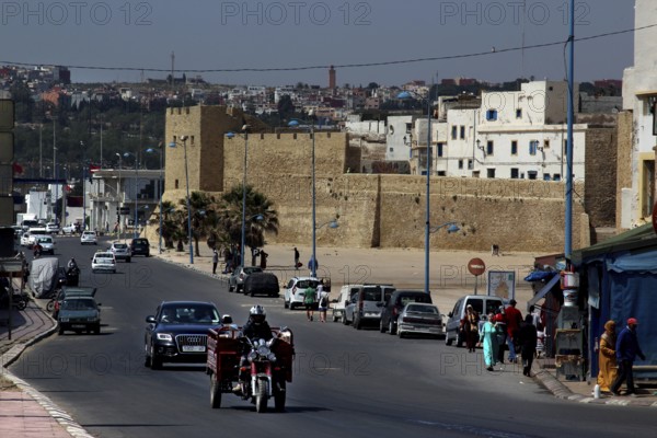 Bustling street in front of the historic city wall in the medina of Safi, Safi, Doukkala-Abda,