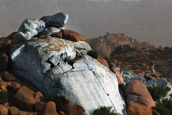 Monumental blue rocks tower over the desert plain in Tafraoute, designed by Jean Verame, Tafraoute,