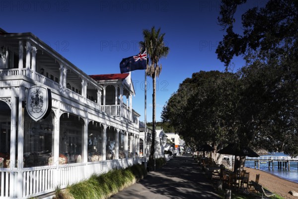Duke of Marlborough Hotel in Russel, historic architecture with flag and palm trees, Russel,