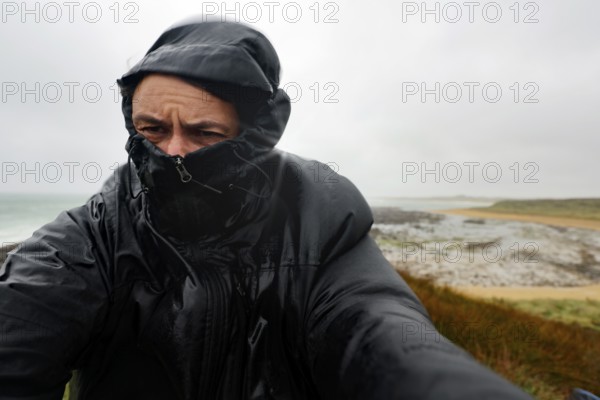 Packed person on a rainy day at Waipapa Point, Waipapa Point, Southland, New Zealand