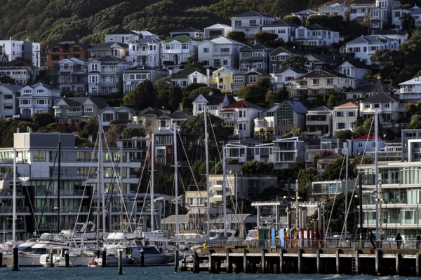 Houses on a hill with harbour and boats in the Wellington district, Wellington, North Island, New