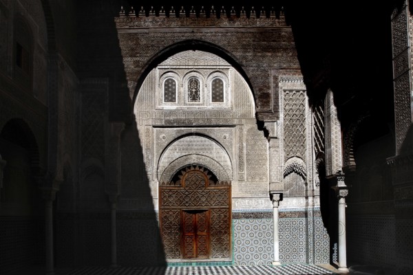 Magnificent Medersa Attarine architecture with ornate wooden doors and decorations, Fez, el-Bali,